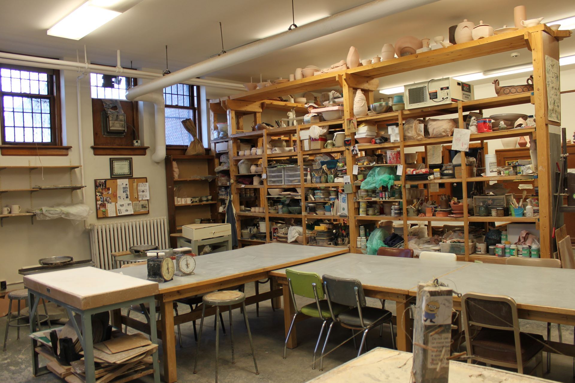 The DAI Ceramics Studio space with shelving and work tables