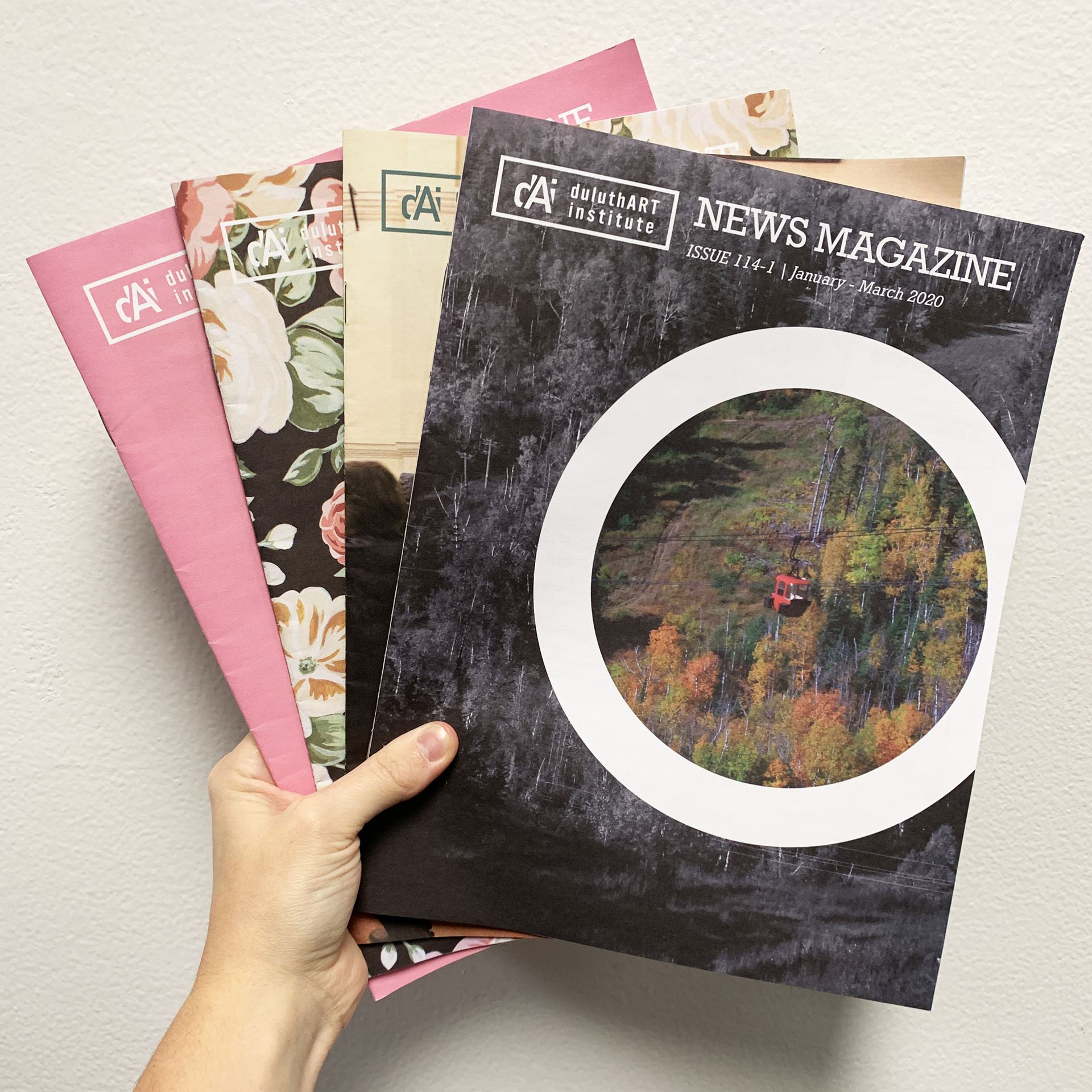 4 past editions of the DAI News Magazine